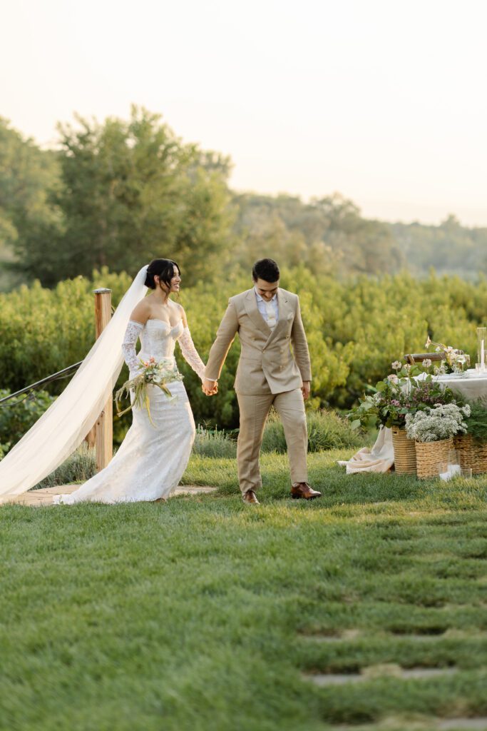 Colorado bride and groom walking together at their reception