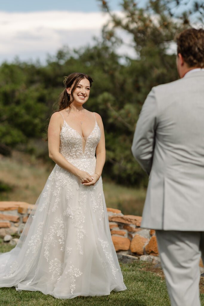 Bride and groom seeing each other for the first time before their Colorado ceremony at Arrowhead Golfcourse