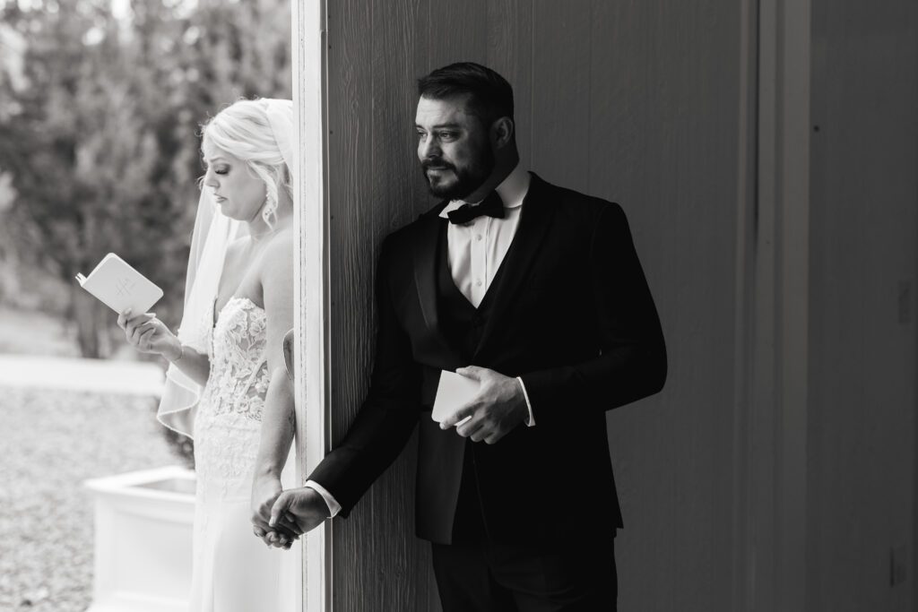 Emotional wedding first touch between bride and groom in Colorado