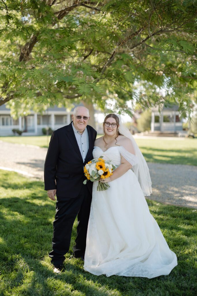 Bride posing with her Grandpa after her Colorado wedding ceremony
